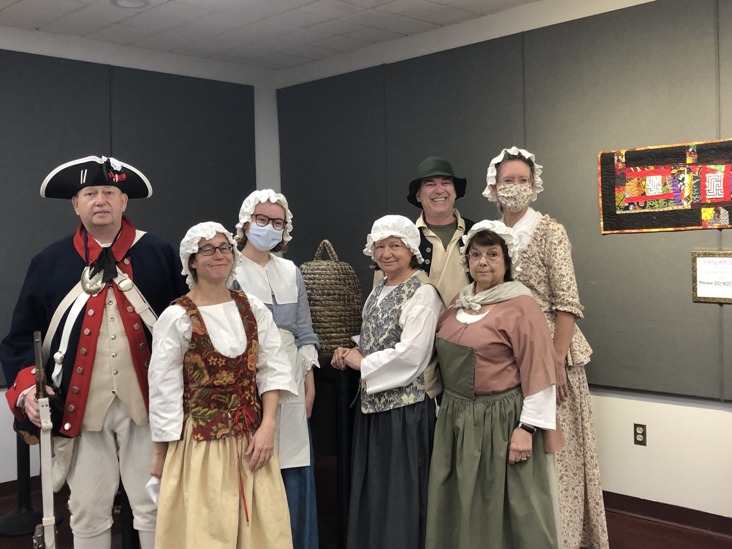 people dressed in Colonial American costumes