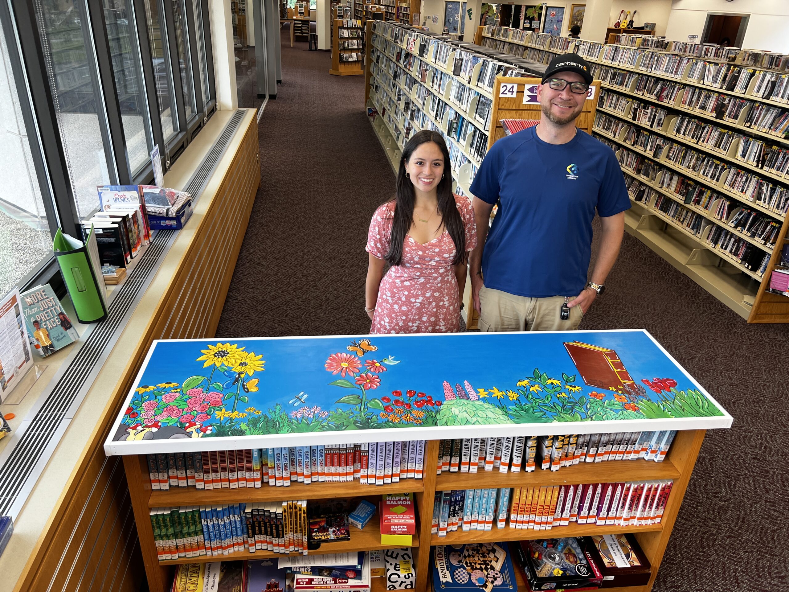 Students Standing in Front of Painting at Library