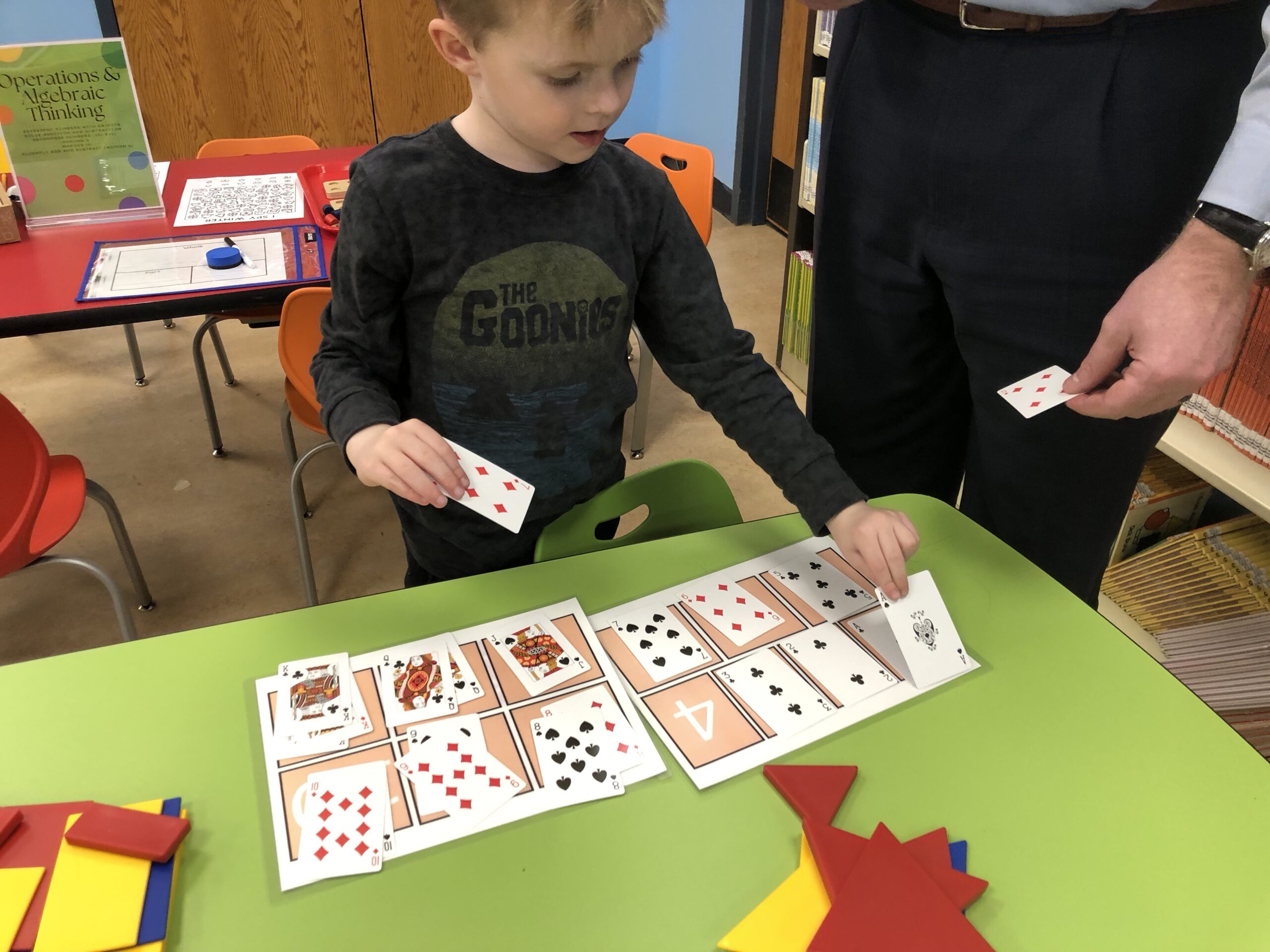 child playing with cards