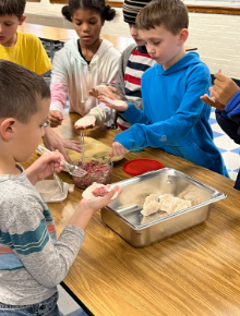 children making dumplings