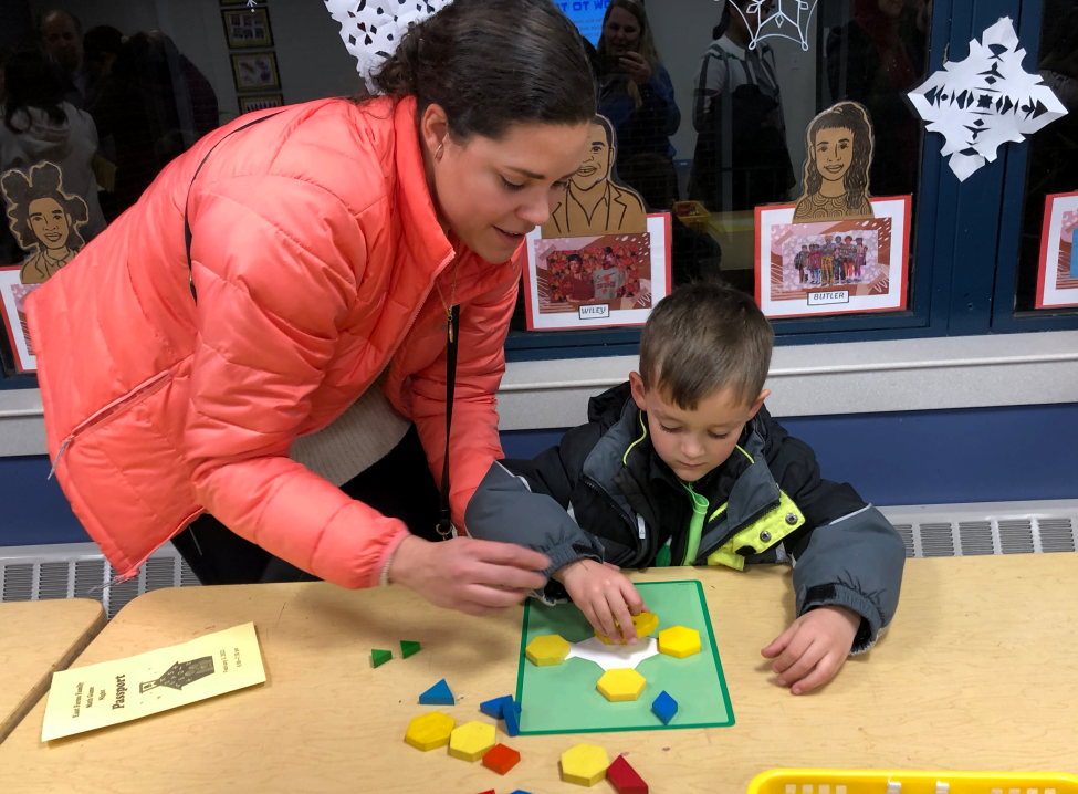 parent and child playing with blocks